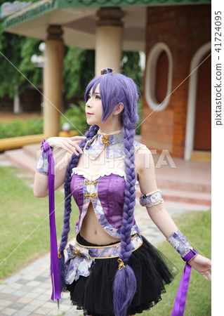Portrait of asian young woman dancing with purple Chinese dress cosplay with temple 41724095