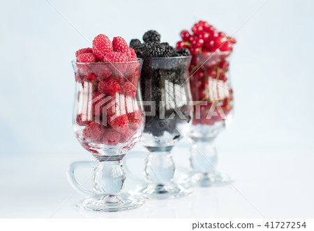 Raspberry a big black blackberry and red currant Raspberry a big black blackberry and red currant 41727254