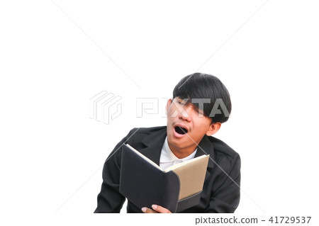 student yawn holding book on white background student yawn holding book on white background 41729537