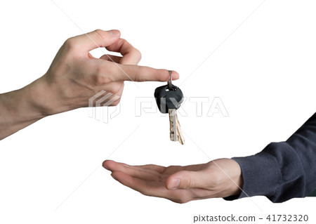 Hand handing over car keys with finger 41732320