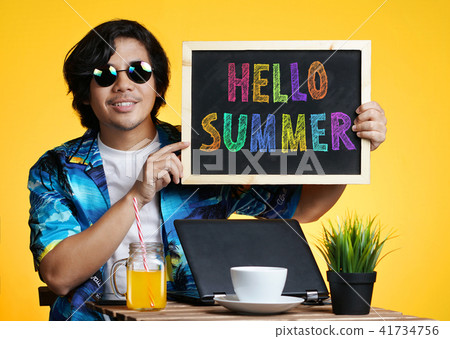 Asian Man Holding Empty Blackboard While Working 41734756