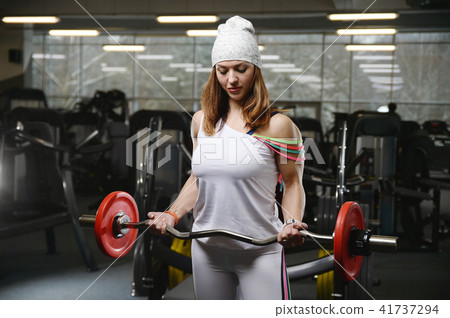 strong sexy athletic young girl working out in gym 41737294