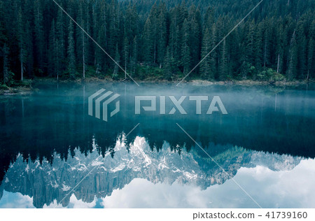 The Karersee lake with reflection of mountains in the Dolomites. 41739160