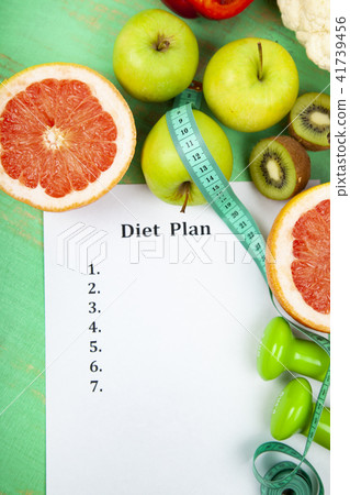 Food and sheet of paper with a diet plan Food and sheet of paper with a diet plan 41739456