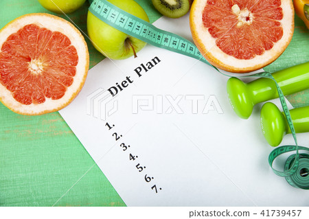 Food and sheet of paper with a diet plan Food and sheet of paper with a diet plan 41739457