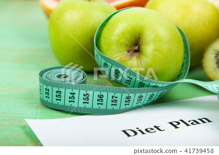 Food and sheet of paper with a diet plan Food and sheet of paper with a diet plan 41739458