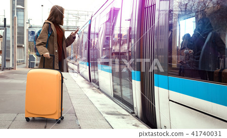 girl tourist  waits for the train 41740031