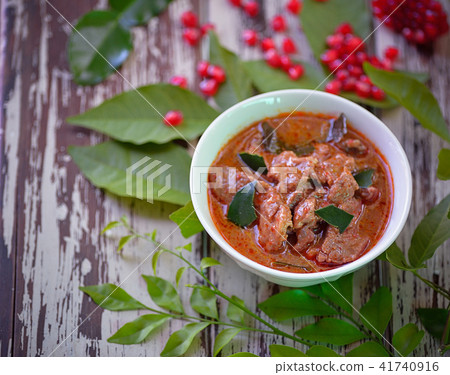 pork Curry , Thai cuisine on wooden background. pork Curry , Thai cuisine on wooden background. 41740916