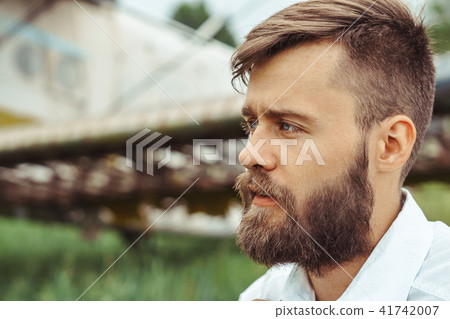 a man on the background of an old plane 41742007