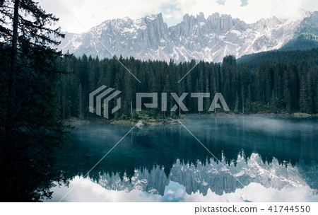 The Karersee lake with reflection of mountains in the Dolomites. 41744550