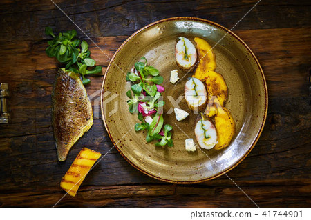 The fish fillet with green asparagus. Shallow dof. The fish fillet with green asparagus. Shallow dof. 41744901