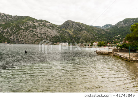 Romantic Mediterranean cloudly landscape. Montenegro, view of Bay of Kotor. Romantic Mediterranean cloudly landscape. Montenegro, view of Bay of Kotor. 41745849