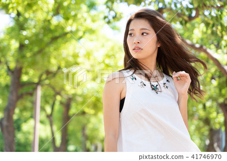 Female portrait green back 41746970