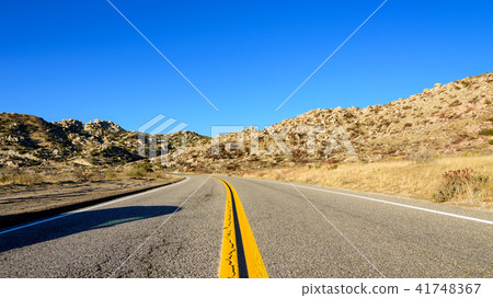 A straight single road in the Americas A straight single road in the Americas 41748367