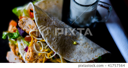 Tasty fresh wrap sandwich with meat 41757564