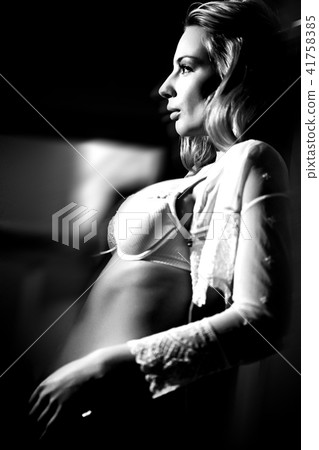 The young beautiful blond woman portrait, studio shot. The young beautiful blond woman portrait, studio shot. 41758385