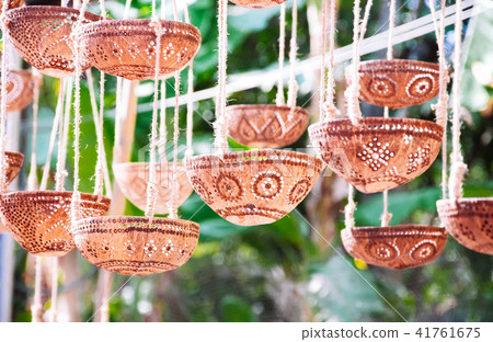 Decorative lamps or plant pot from a coconut shell Decorative lamps or plant pot from a coconut shell 41761675