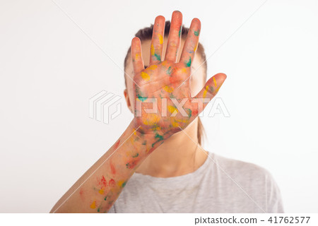girl covers her face with her palm in paint girl covers her face with her palm in paint 41762577