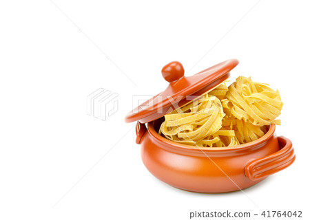Pasta in a clay pot isolated on white background.  41764042