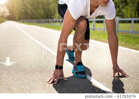 Sportsman with tracker is getting ready to run outdoors 41765074