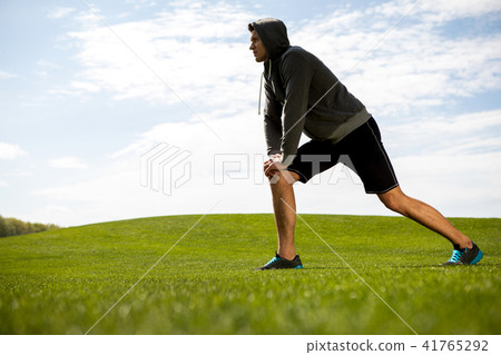 Athlete is exercising in nature Athlete is exercising in nature 41765292