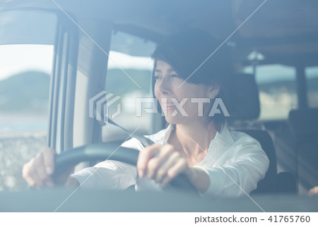 Women in their 50s driving a car Women in their 50s driving a car 41765760