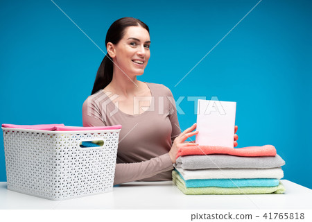 Delighted housewife satisfied with washing powder results 41765818