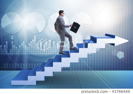 Businessman climbing career ladder in business concept Businessman climbing career ladder in business concept 41766489