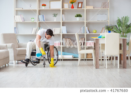Disabled cleaner doing chores at home Disabled cleaner doing chores at home 41767680