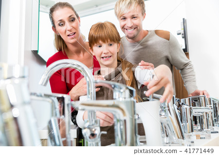 Portrait of a happy family together in the interior of a modern shop 41771449