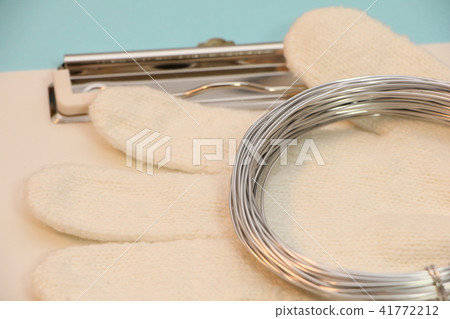 Gloves and wires placed on the clipboard Gloves and wires placed on the clipboard 41772212