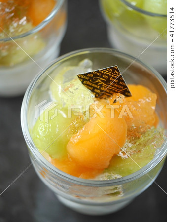 Melon and Jure 's panna cotta black background (high angle up) Melon and Jure 's panna cotta black background (high angle up) 41773514