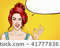 Pop art winking woman showing OK sign  41777836