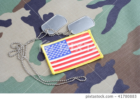 US flag patch with dog tags on camouflage uniform 41780883