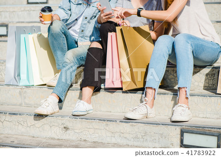 Asian woman use smartphone while shopping. Asian woman use smartphone while shopping. 41783922