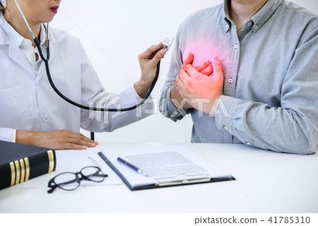 Female doctor checking heart beat of patient and recommend treat 41785310