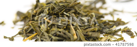 Pile of green tea on white background. Shallow dof Pile of green tea on white background. Shallow dof 41787598