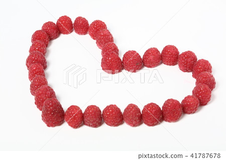 Heart made out of raspberries over white background 41787678