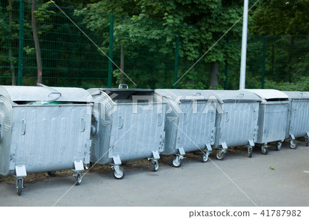 Large metal filled garbage containers Large metal filled garbage containers 41787982