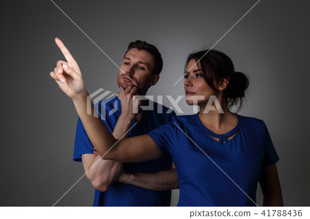 Doctors pointing to something Doctors pointing to something 41788436