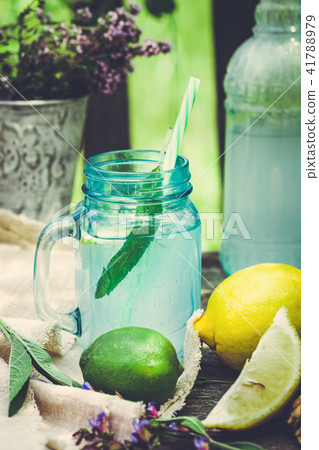Drink infused with lemon and sage Drink infused with lemon and sage 41788979