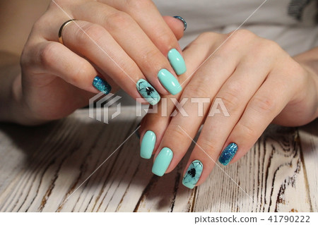 Women's hands with a stylish manicure. 41790222