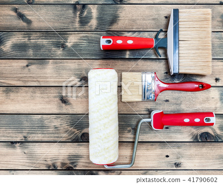 House painter, work tools on yellow background House painter, work tools on yellow background 41790602