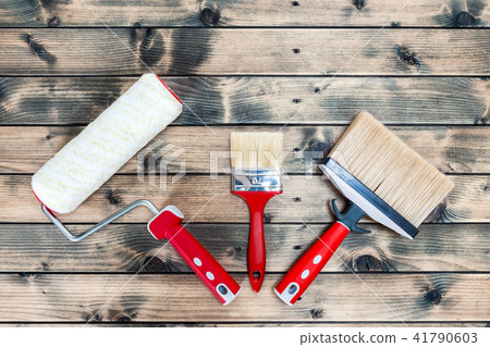 House painter, work tools on yellow background House painter, work tools on yellow background 41790603