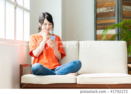 A young lady (a smartphone) A young lady (a smartphone) 41792272