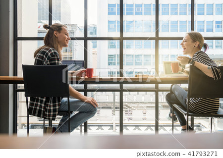 Hipster young couple freelancer talking with happiness and Laugh action in the Loft cafe workplace. Creative Startup and entrepreneur business concept Hipster young couple freelancer talking with happiness and Laugh action in the Loft cafe workplace. Creative Startup and entrepreneur business concept 41793271