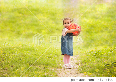 cute little girl playing in park 41797190