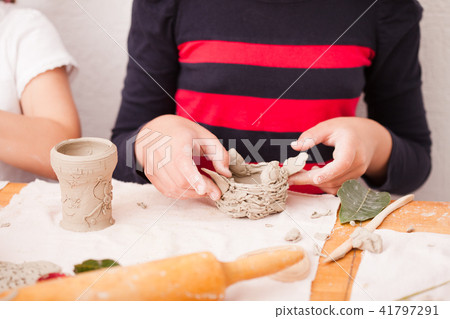 Child hands with plasticine Child hands with plasticine 41797291