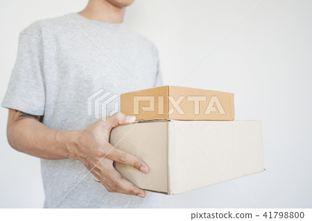 Deliveryman holding parcel boxes package Deliveryman holding parcel boxes package 41798800