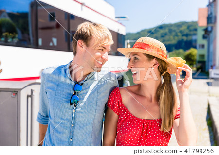 Couple on river cruise in summer wearing sun hats 41799256